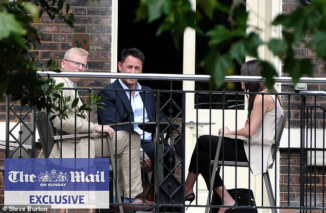 King Charles and Prince Harry's senior aides held a secret peace summit in London. Pictured: The head of communications for Royal Family Tobyn Andreae (left) and Meredith Maines head of communications for The Sussexes (right) with Liam Maguire, who runs the Sussexes' PR team in the UK (centre)