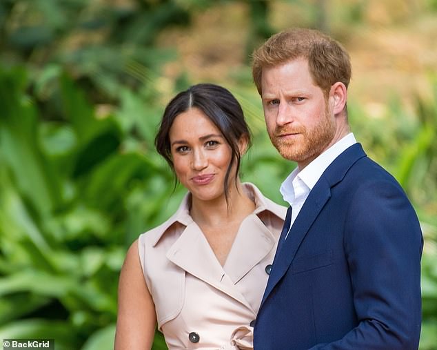 Author Tom Quinn claims that Meghan Markle caused a panic during her brief time as a working member of the family when she signaled she wanted to operate separately from the Queen. Here, she is pictured with Prince Harry