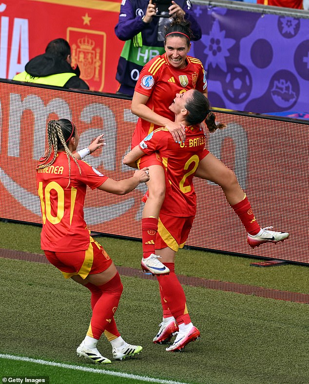 Mariona Caldentey of Spain celebrates scoring her team's first goal with teammates Athenea del Castillo and Ona Batlle