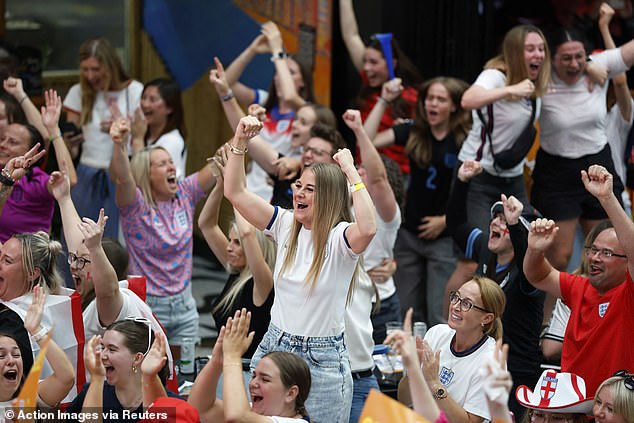 England fans celebrate their first goal scored by England's Alessia Russo