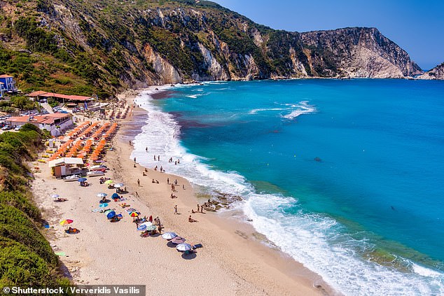Petani Beach in Kefalonia features turquoise waters, golden sand, and is surrounded by cliffs (file image)
