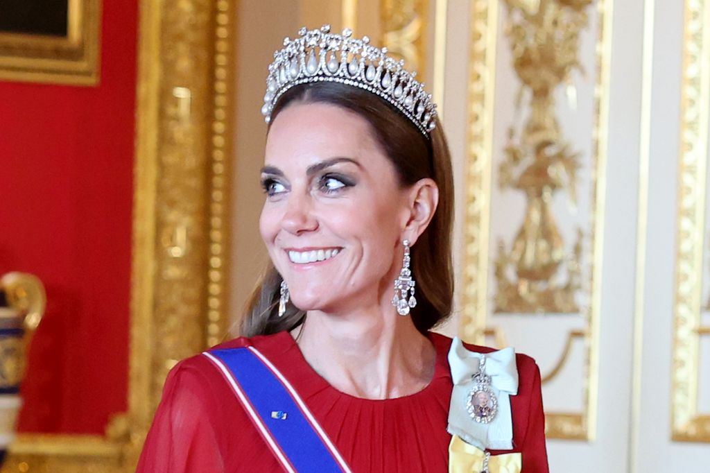 Kate Middleton smiling in diamond tiara and earrings