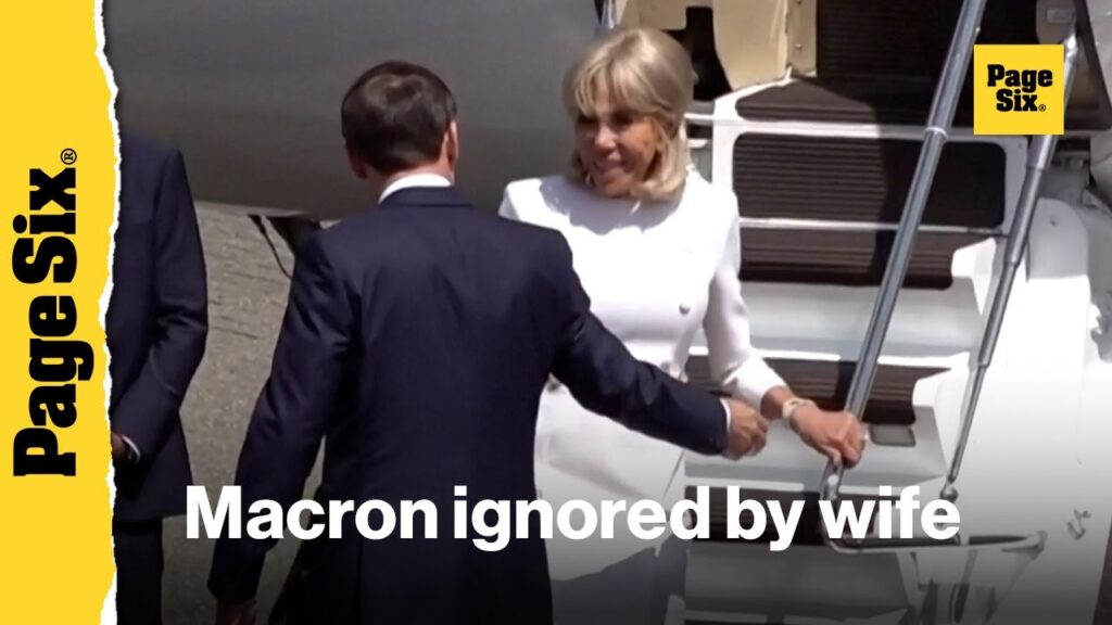 Macron’s wife rejects his help as they get off plane, weeks after she was filmed shoving his face Macron’s wife rejects his help as they get off plane, weeks after she was filmed shoving his face