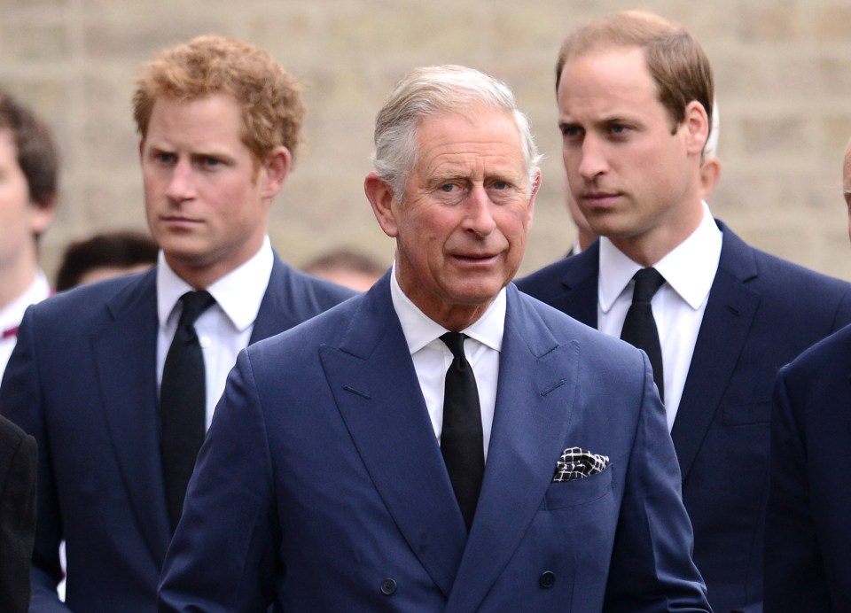 Prince Charles with Prince Harry and Prince William at a requiem mass.