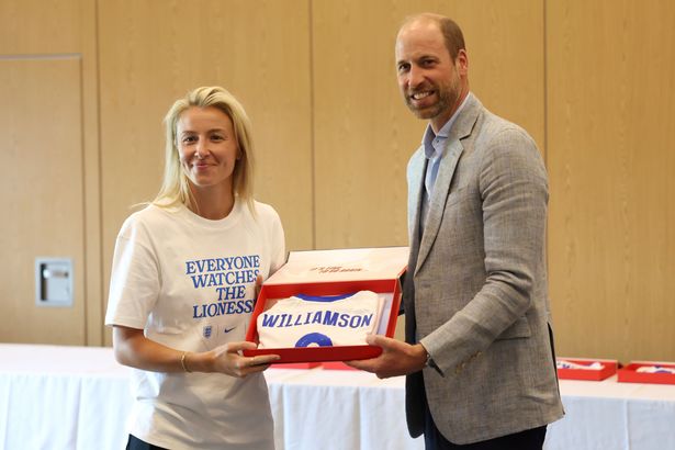 William hands over a shirt to Lioness Leah Williamson ahead of the Euros 