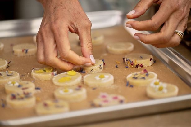 The flower sprinkles Meghan uses in the show are also part of the product line 