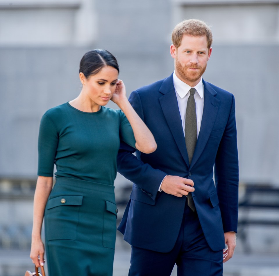 Prince Harry and Meghan Markle walking together.