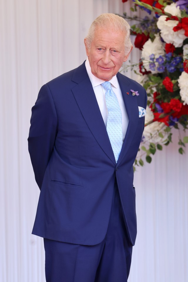King Charles III in a blue suit.