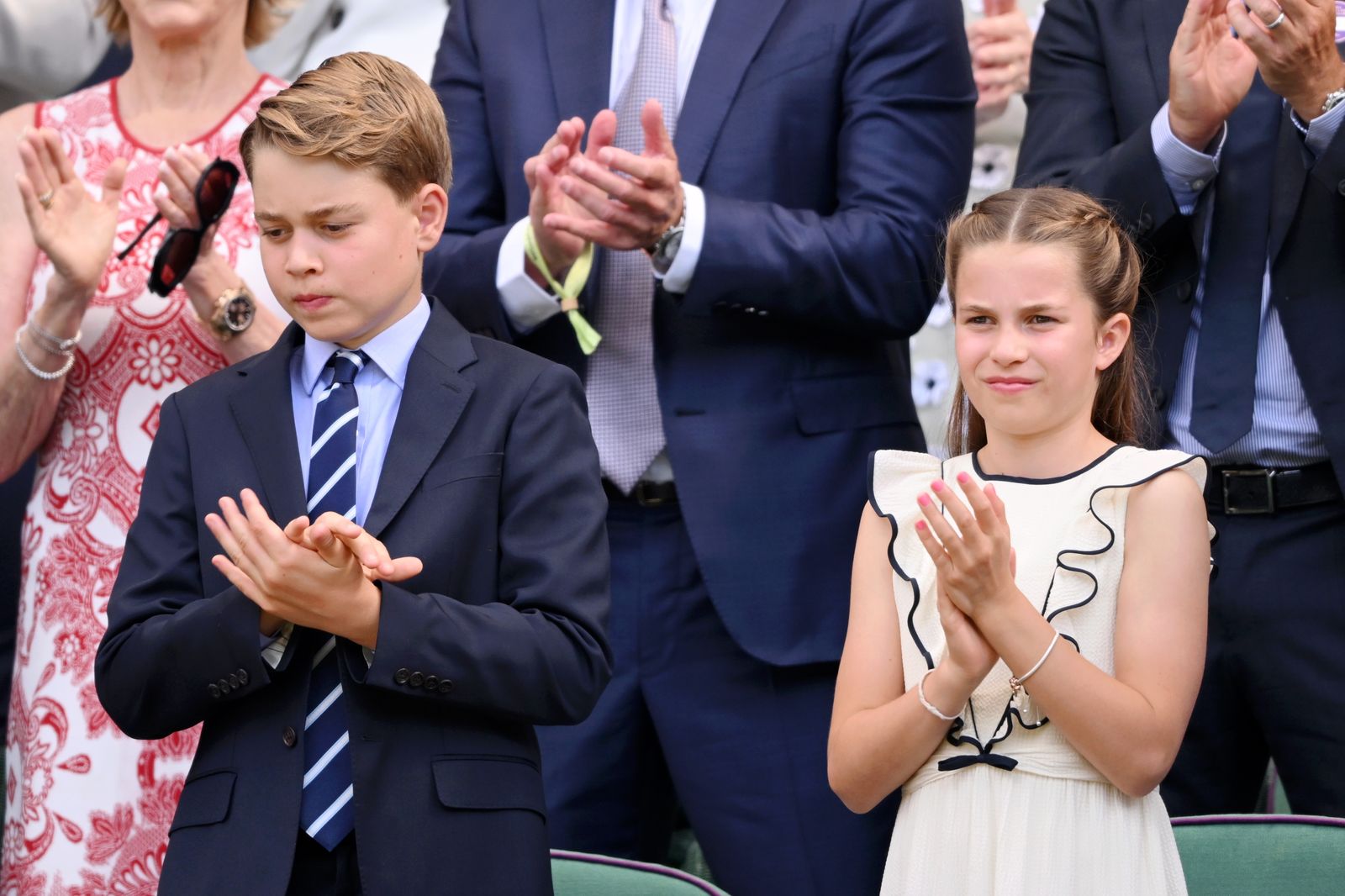 Image may contain Prince George of Cambridge Applause Person Accessories Formal Wear Tie Belt Adult and Wedding