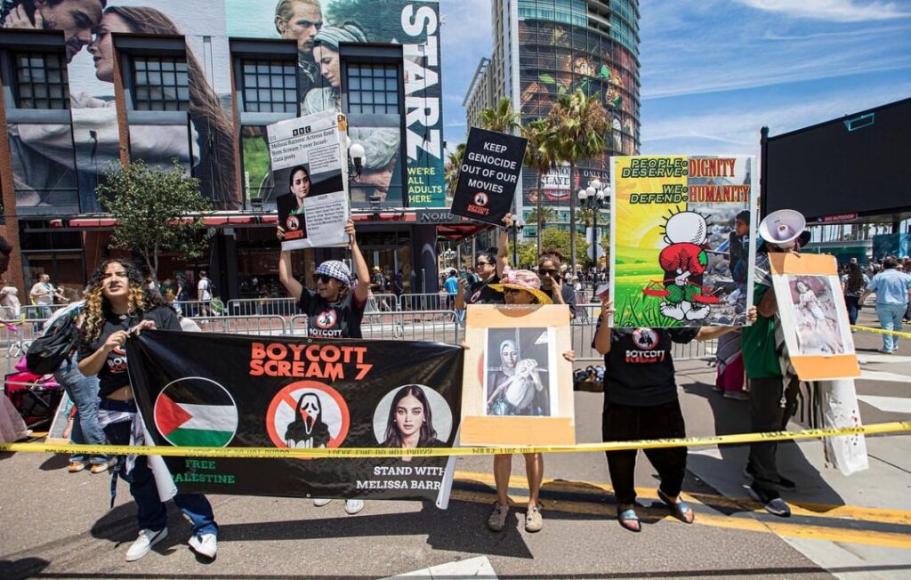 Protesters at San Diego Comic-Con called for a boycott of ‘Scream 7’ & Paramount after Melissa Barrera was fired for her public condemnation of Israel’s genocide in Palestine. Organized by CODEPINK & Entertainment Labor for Palestine. (July 24, 2025) Protesters at San Diego Comic-Con called for a boycott of ‘Scream 7’ & Paramount after Melissa Barrera was fired for her public condemnation of Israel’s genocide in Palestine. Organized by CODEPINK & Entertainment Labor for Palestine. (July 24, 2025)