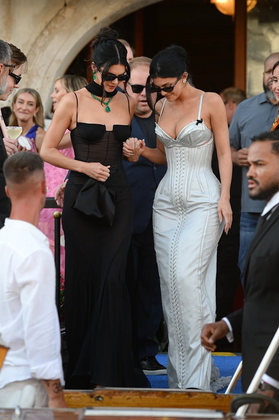 For the ceremony, Kylie nearly broke the rules by wearing a corseted satin dress by Dilara Findikoglu that was similar to a white gown. COBRA TEAM / BACKGRID