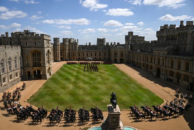 JAIMI JOY/POOL/AFP via Getty Household Calvary units participate in a ceremonial welcome at Windsor Castle to mark the start of the start visit from France on July 8, 2025.
