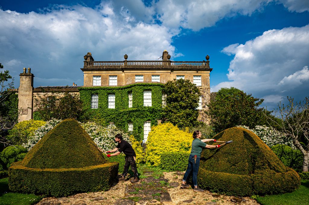 Gardeners attend to topiary bushes at King Charles III and Queen Camilla's private residence in the gardens of Highgrove, Gloucestershire, ahead of world topiary day on May 12th, where the gardens are open to the public and welcome tens of thousands of visitors between April and October every year. Picture date: Tuesday May 7, 2024.