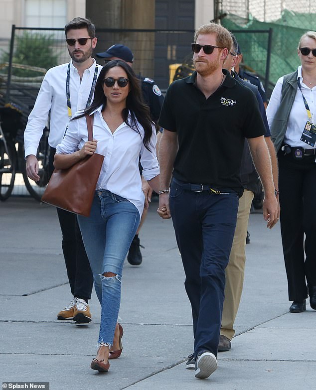 Harry and Meghan’s right-hand man appears to extend an olive branch to two senior royal household staff including William’s aide Jason Knauf who exposed Meghan Markle ‘bullying’ allegations Jason Knauf (left) is pictured with Harry and Meghan attending the Invictus Games in Toronto. He accused Meghan of bullying staff and then quit the royal household after Megxit