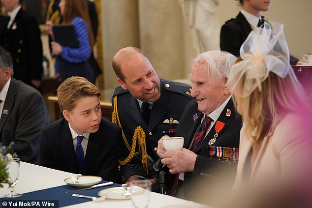 George joins his father at an event in Buckingham Palace meeting World War Two veterans