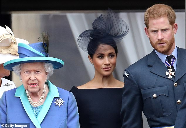 The Queen with Harry and Meghan in July 2018. Meghan allegedly tried to 'outshine' the Queen during her time as a working royal