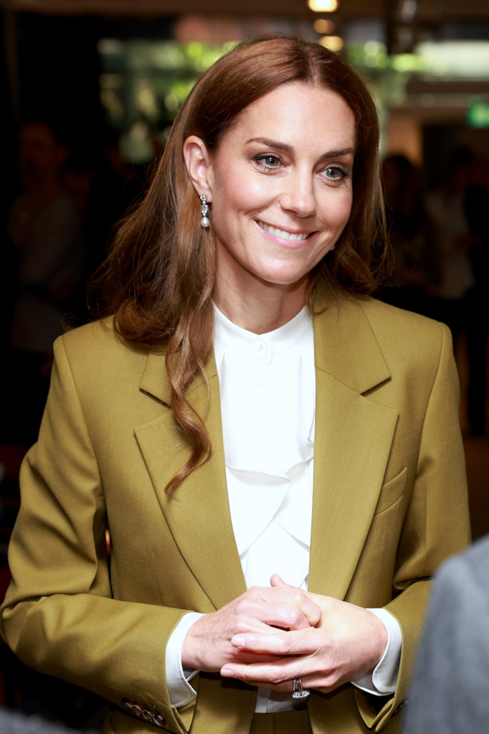 Kate Middleton with mocha bronde hair and ring stack