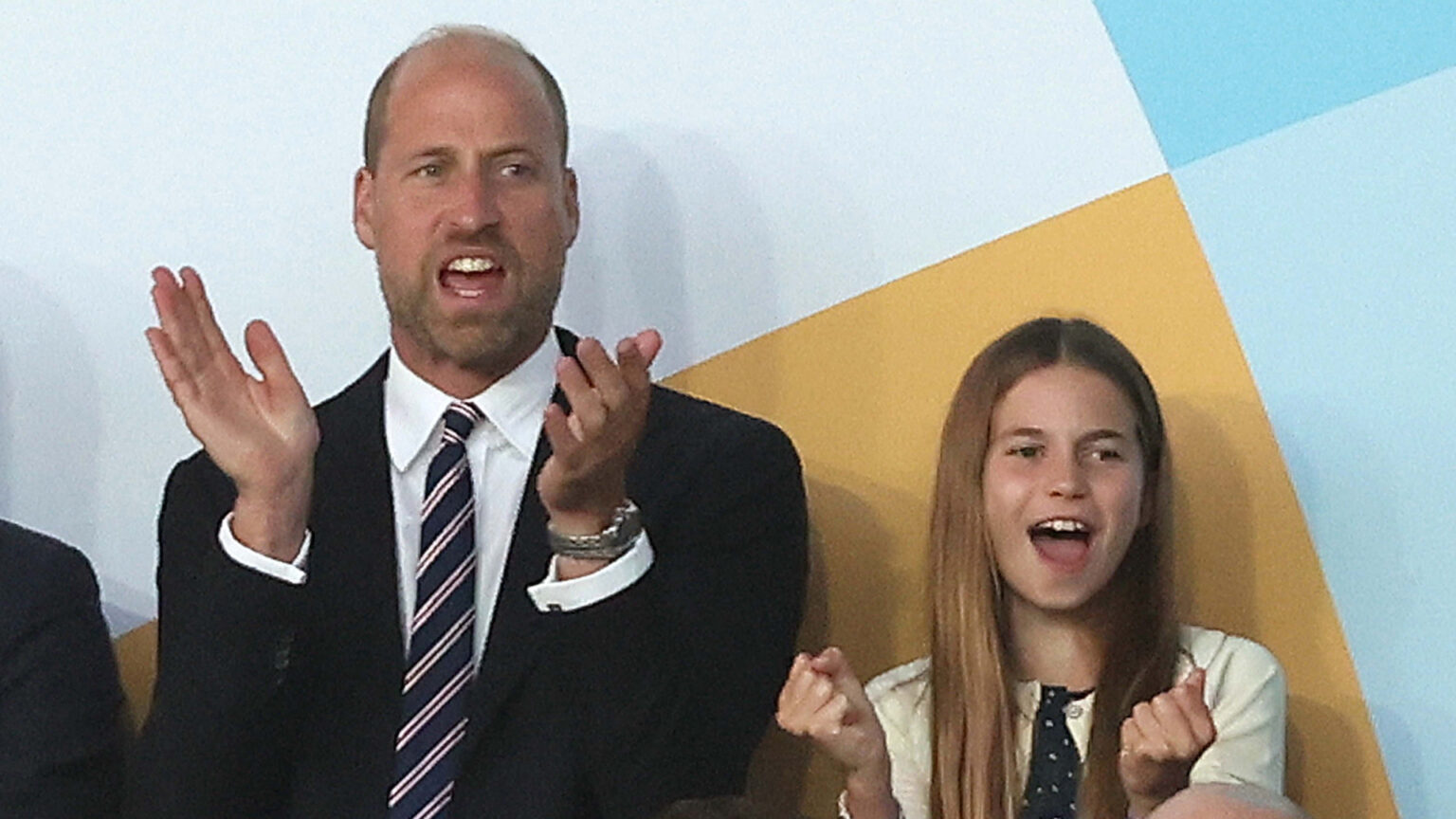 How Princess Charlotte’s First X Message Breaks Protocol Prince William wears a suit with a red, white, and blue striped tie, and daughter Princess Charlotte wears a navy and white polka dot dress, as the pair attend the UEFA Women's Championship in Switzerland