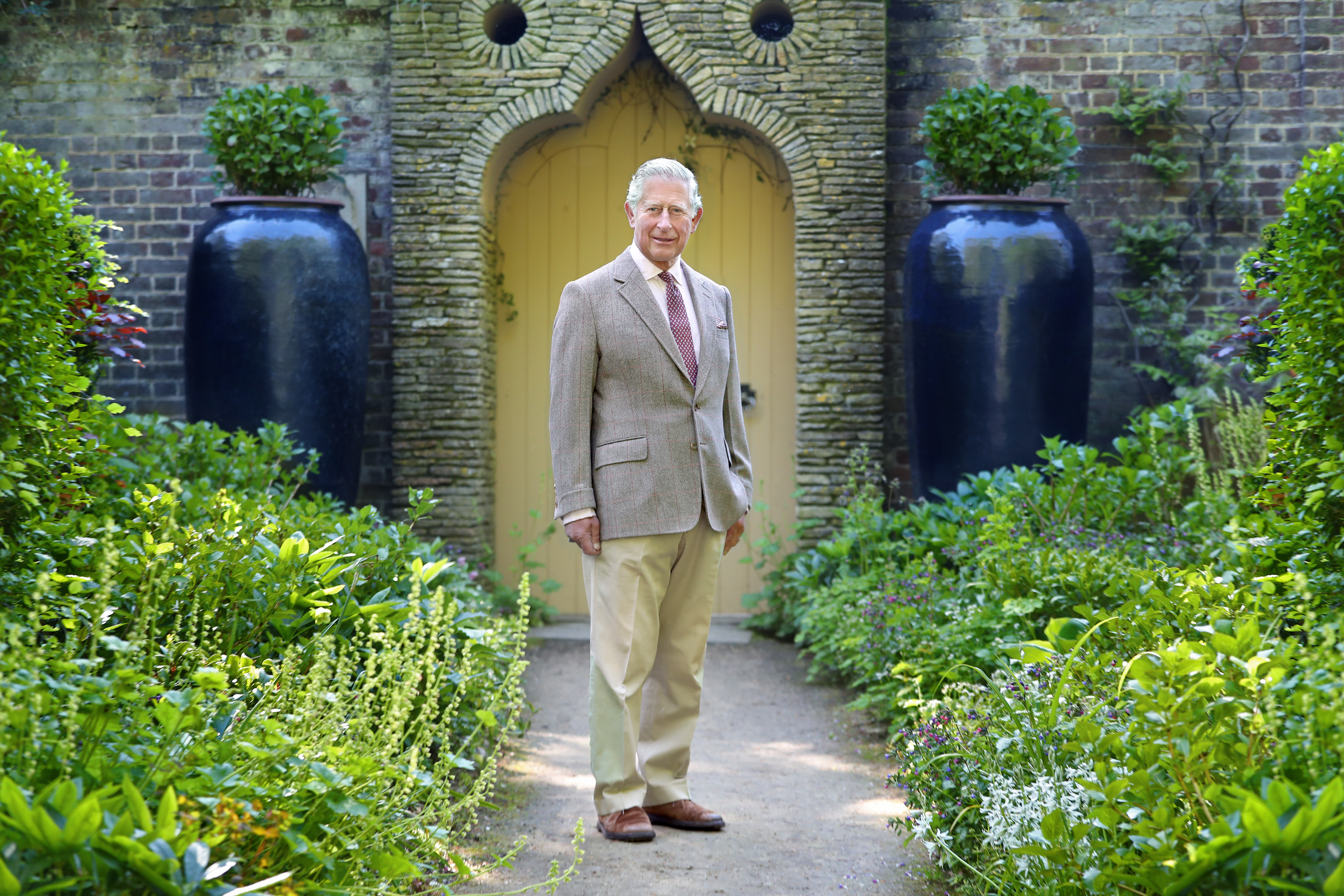 King Charles poses at his private property, Highgrove House
