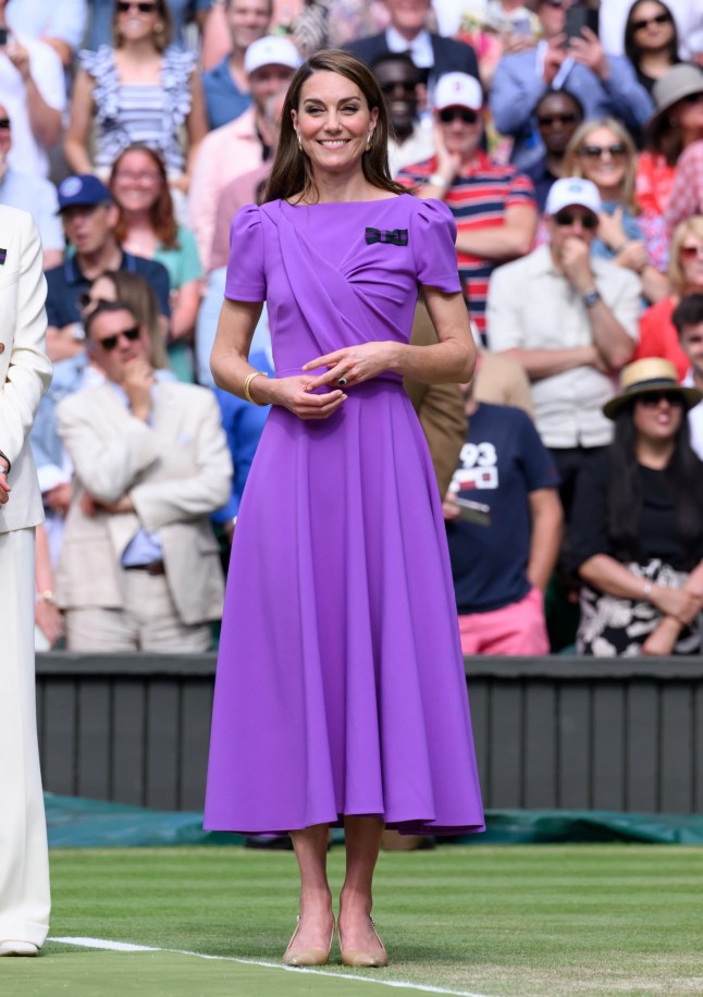 LONDON, ENGLAND - JULY 14: Catherine, Princess of Wales on court to present the trophy to the winner of the men's final on day fourteen of the Wimbledon Tennis Championships at the All England Lawn Tennis and Croquet Club on July 14, 2024 in London, England. (Photo by Karwai Tang/WireImage)