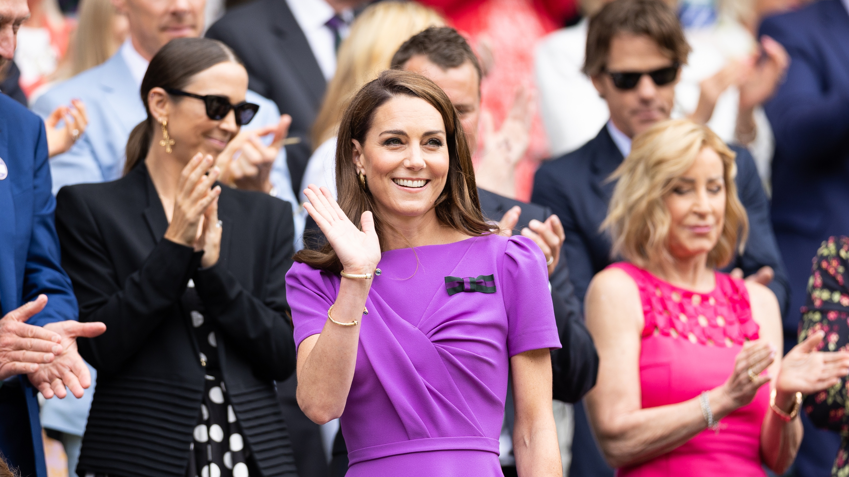 Catherine, Princess of Wales waves to the crowd from the Royal Box before the start of the Men's Singles Final at Wimbledon on July 14th, 2024
