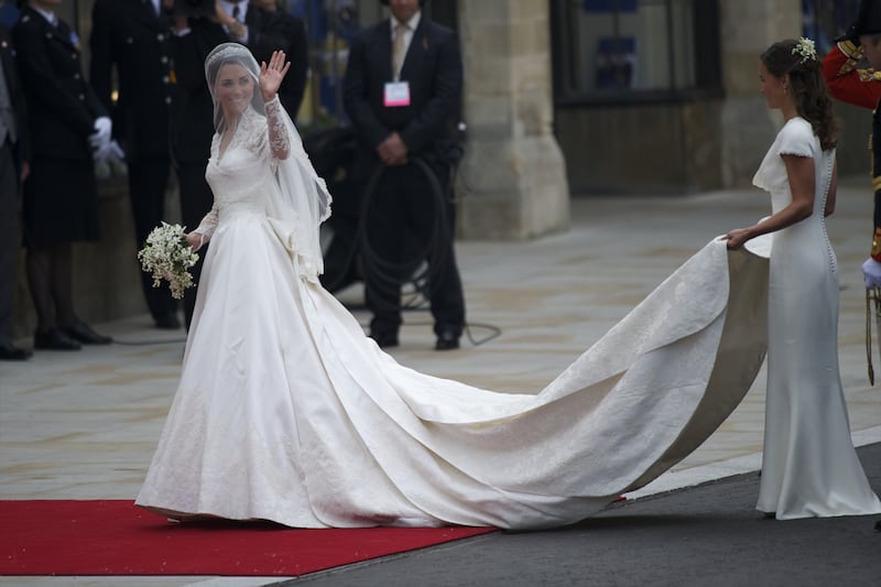 Kate Middleton arrives at Westminster Abbey for her wedding to Prince William in her McQueen gown by Sarah Burton.