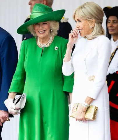 Samir Hussein/WireImage Queen Camilla and Brigitte Macron share a laugh on the during the French state visit to the U.K. on July 8, 2025
