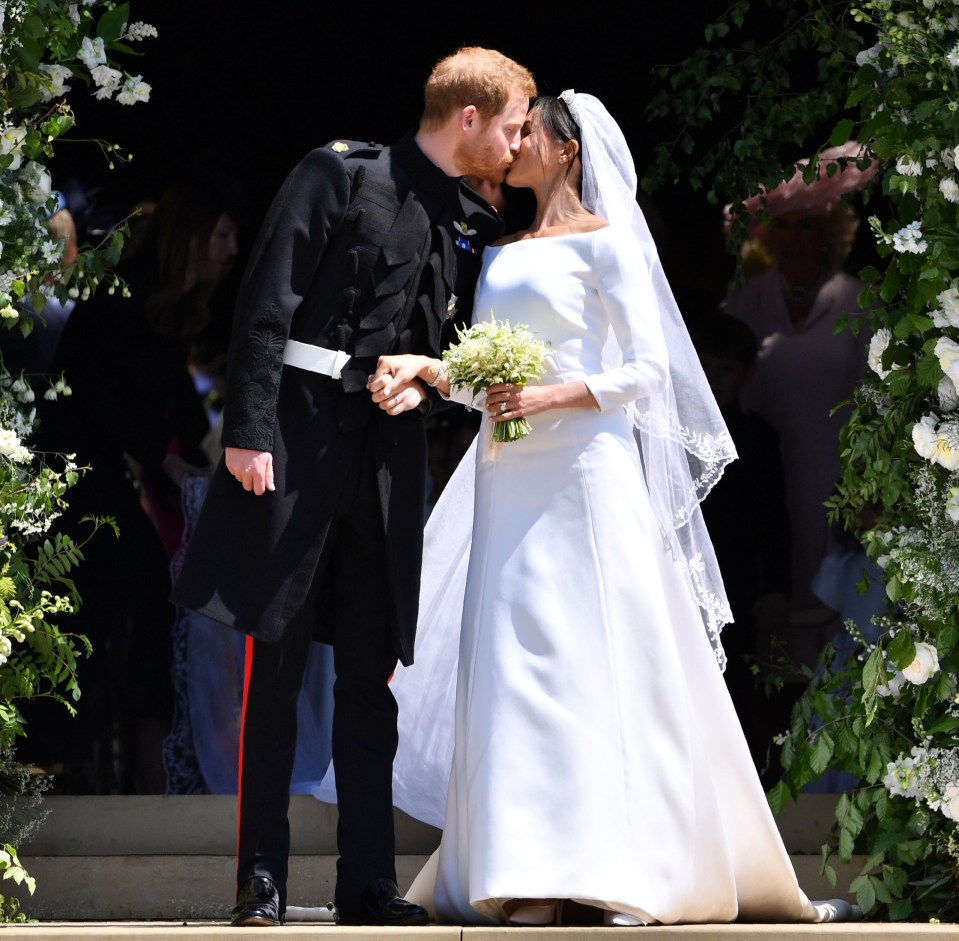 Prince Harry and Meghan Markle kissing after their wedding ceremony at Windsor Castle.