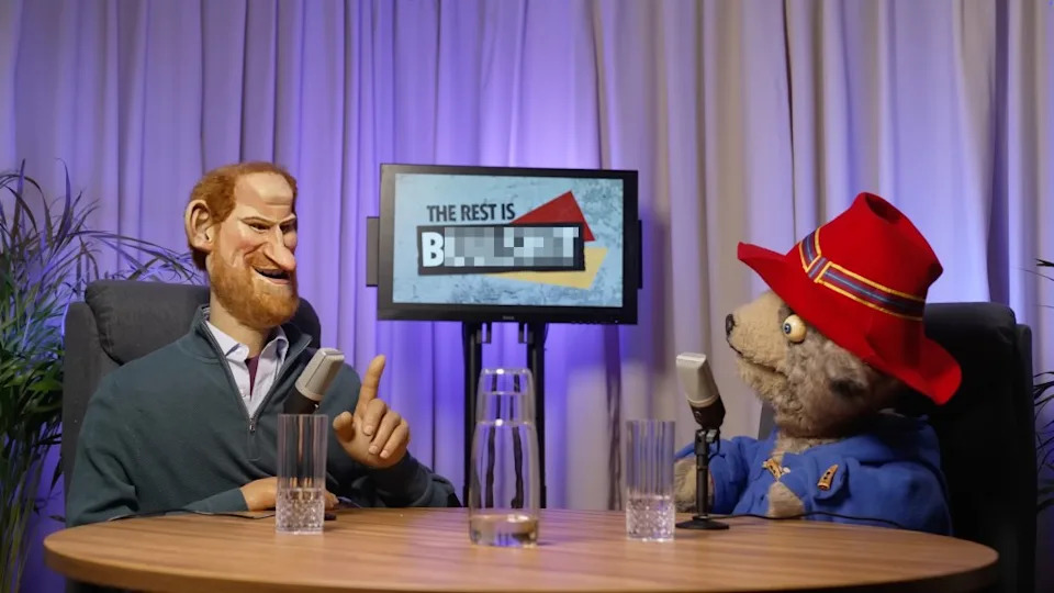 The episode sees Harry hosts a podcast, titled “The Rest is Bulls–t,” alongside a puppet of Paddington Bear. @SpittingImage/YouTube