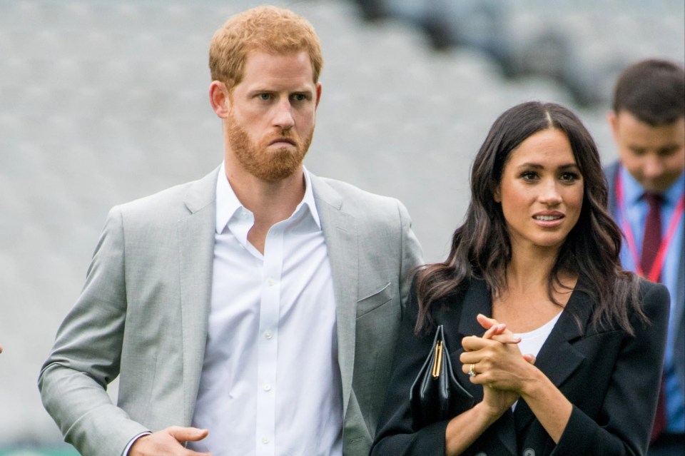 Prince Harry and Meghan Markle walking together.