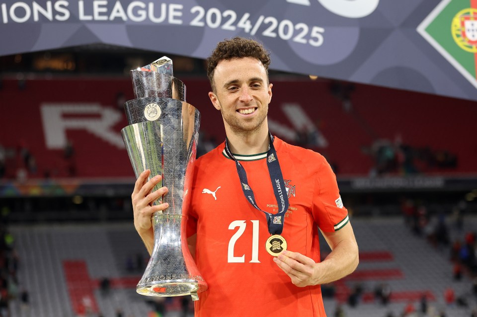 Diogo Jota of Portugal holding the UEFA Nations League trophy and medal.