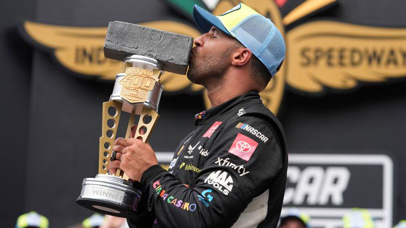 Bubba Wallace became the first Black driver to win a major race on Indianapolis Motor Speedway, surviving a late rain delay, two overtimes and concerns over running out of fuel on Sunday in the Brickyard 400.