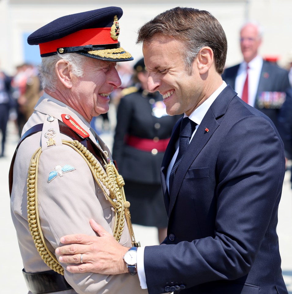 King Charles III and Emmanuel Macron at a commemorative event.