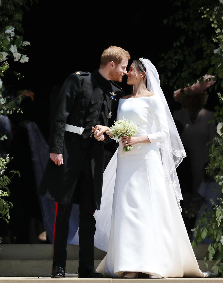 Prince Harry and Meghan Markle kissing after their wedding at Windsor Castle.