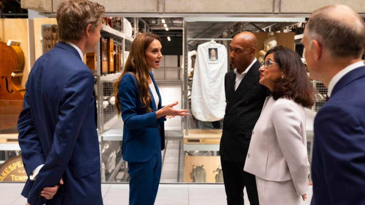 Princess of Wales Kate Middleton in a blue dress with V&A Director Tristram Hunt (left), V&A East Storehouse Director Gus Casely-Hayford (right), and Board Chair Minouche Shafik