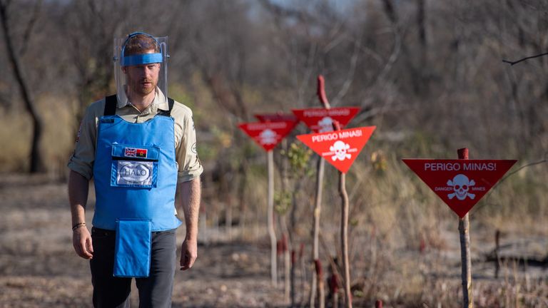Prince Harry walks through a minefield in Dirico, Angola