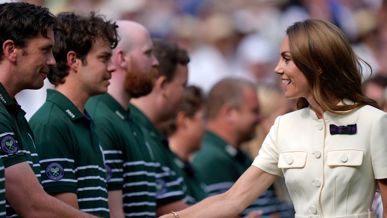 The Princess of Wales speaks with Wimbledon staff on centre court following the Ladies' Singles Final Pic: PA 