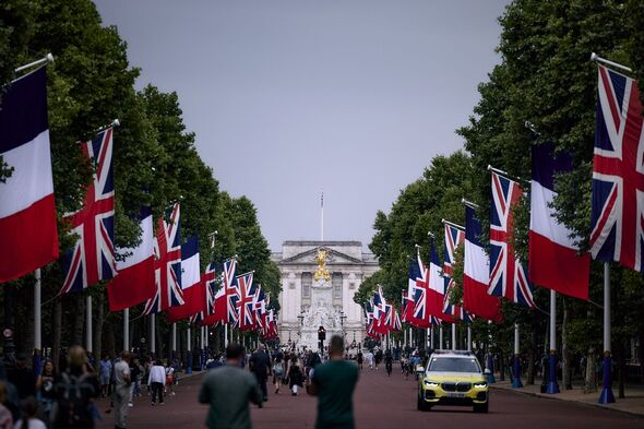 British and French flags are are displayed down The Mall in London British and French flags are are displayed down The Mall in London