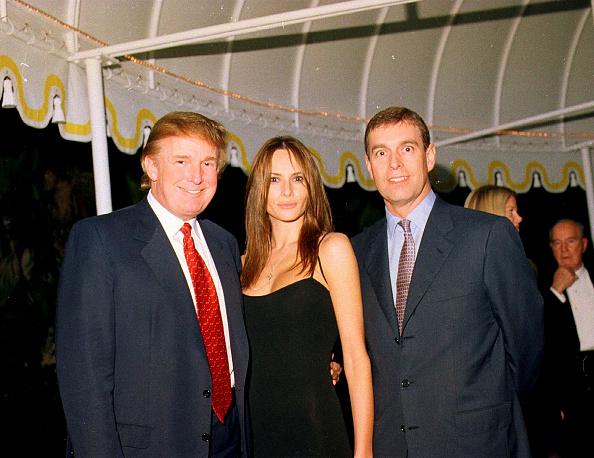 Donald Trump, his girlfriend (and future wife), former model Melania Knauss and Prince Andrew pose together at the Mar-a-Lago estate, Palm Beach, Florida, 12 February 2000. (Photo by Davidoff Studios/Getty Images)