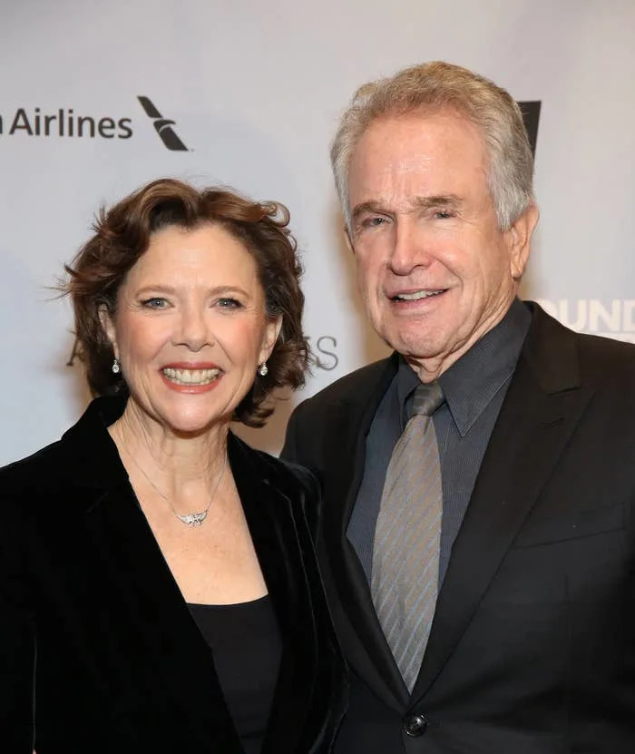 Annette Bening and Warren Beatty smiling at an event