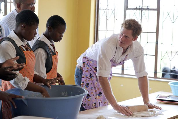 Prince Harry bakes at the Kananelo Centre in Maseru for the Deaf that works with Sentebale