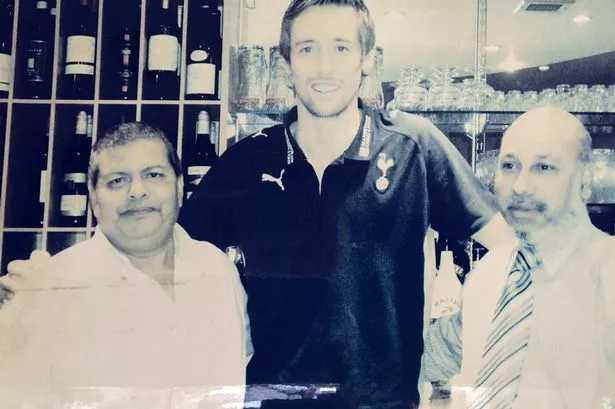Peter Crouch, centre, with restaurant management