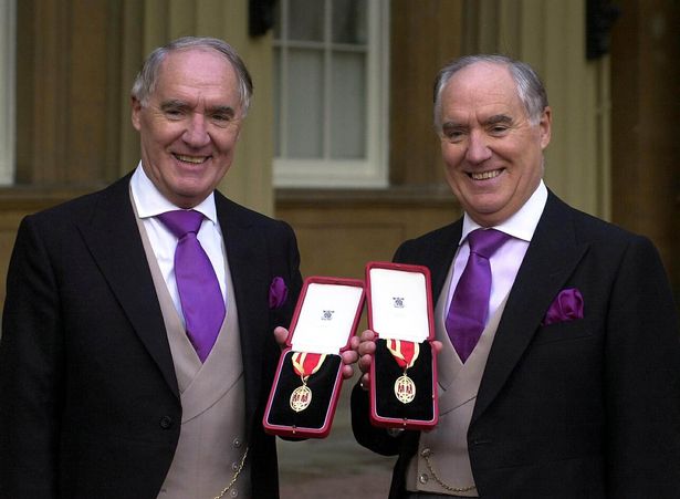 Sir David Barclay (left) and his twin brother Sir Frederick after receiving their knighthoods from the Queen at Buckingham Palace