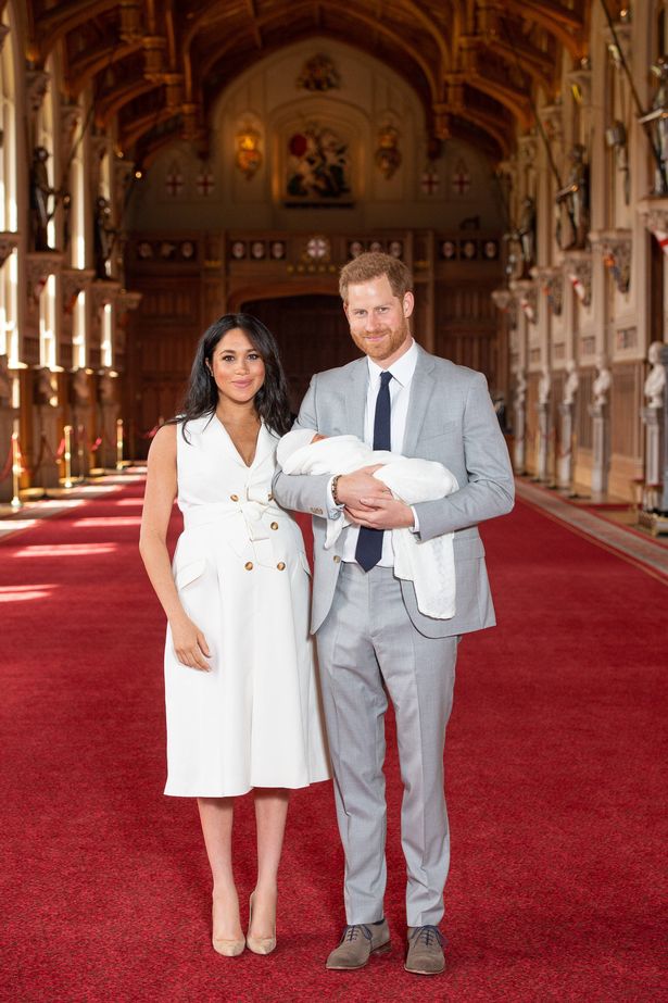 Prince Harry, Duke of Sussex and Meghan, Duchess of Sussex, pose with their newborn son Archie Harrison Mountbatten-Windsor 
