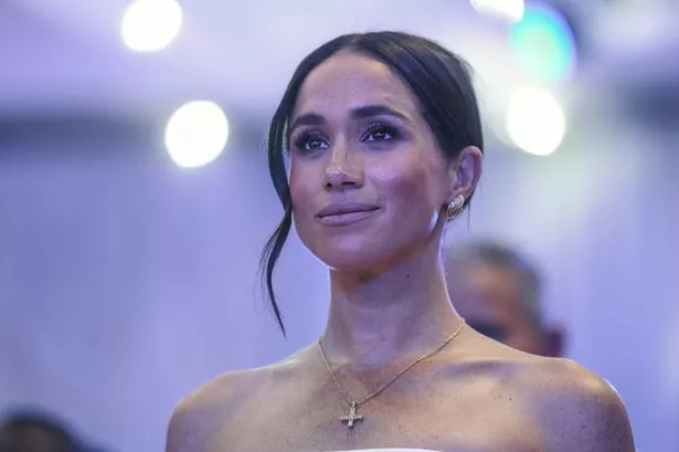 Meghan looks on as she attends a Sit Out with Prince Harry at the Nigerian Defence Headquarters in Abuja on May 11, 2024 as they visit Nigeria as part of celebrations of Invictus Games anniversary