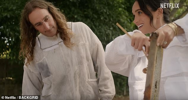 Meghan collecting  honey on her show