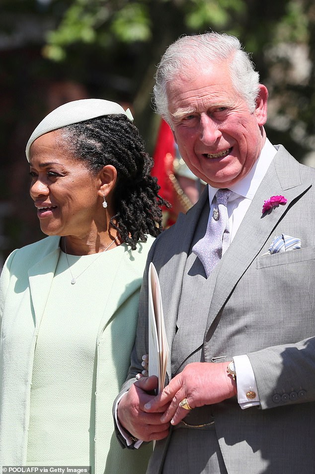 Meghan's mother, Doria Ragland, is pictured with Charles on the Sussexes' wedding day, which Thomas did not attend