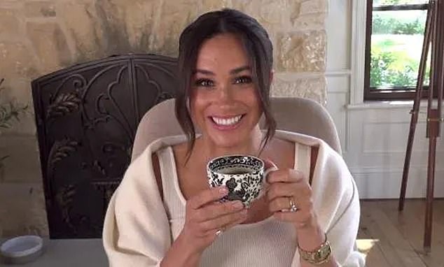 Meghan drinking a cup of tea at her home in Montecito. A royal author claimed that Meghan allegedly 'threw a cup of tea into the air' during a dramatic outburst on the tour