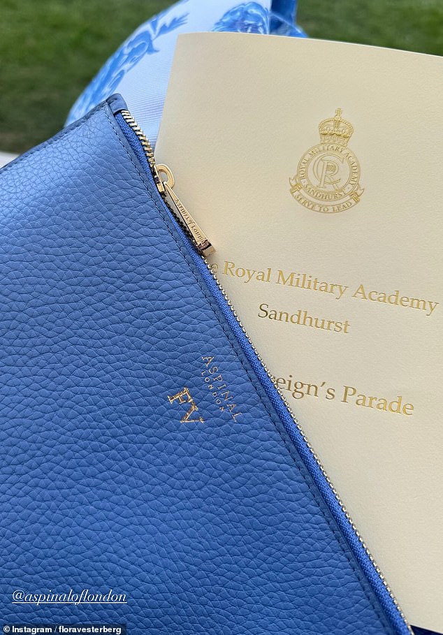 Flora paired her ensemble with a blue Aspinal of London clutch bag, which was personalised with her gold initials 'FV'