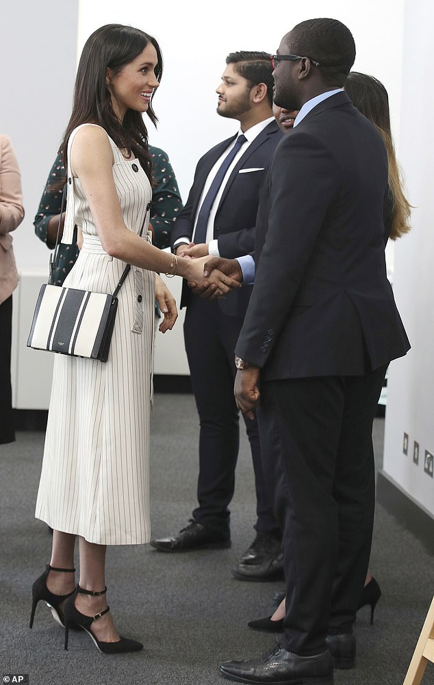 Meghan is pictured shaking hands with delegates at the reception for the Commonwealth Youth Forum